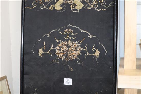 A pair of Chinese/Tibetan embroidered black satin qilin panels, late 19th/early 20th century, 144 x 44cm, worn